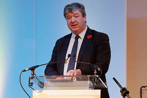 Alistair Carmichael speaks at a podium